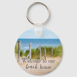 Welkom bij verhuur van vakantiehuis aan het strand sleutelhanger