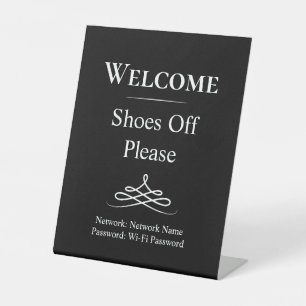 Welkom zwart-witte schoenen uit alsjeblieft voetst reclamebord met voetstuk