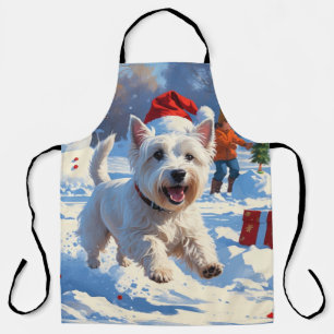Westie rent in de sneeuw met kerstmuts schort