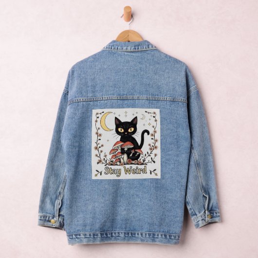 Whimsical noir cat framed by red mushrooms and pal (Hangar)