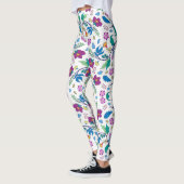 White leggings with vibrant floral patterns (Gauche)