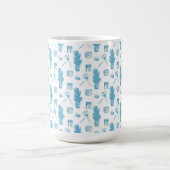 White mug with a blue cactus pattern (Centre)