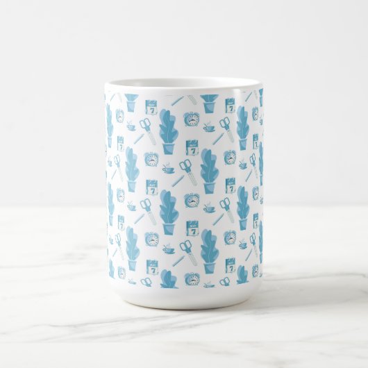 White mug with a blue cactus pattern (Centre)