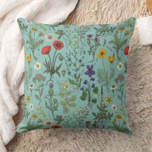 Wilde bloemen collage op blauw kussen
