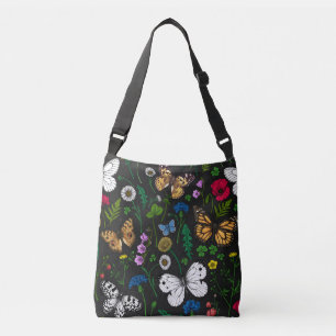 Wilde bloemen en vlinders op zwart crossbody tas