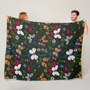 Wilde bloemen en vlinders op zwart fleece deken
