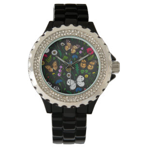 Wilde bloemen en vlinders op zwart horloge