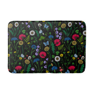 Wilde bloemen op zwart badmat