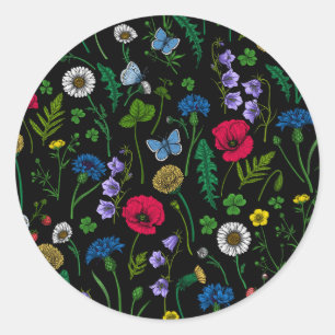 Wilde bloemen op zwart ronde sticker