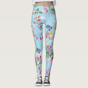 Wilde bloemen tegen een blauwe hemel leggings
