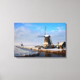 Windmolen in de sneeuw in een nederlands winterlan canvas afdruk
