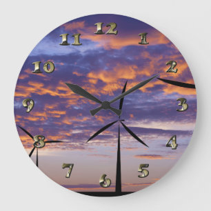 Windmolenturbine op zonsondergang grote klok