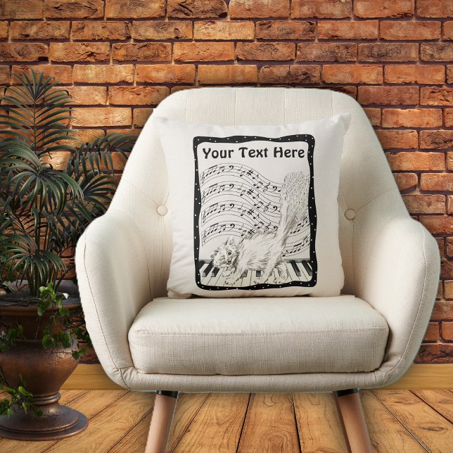Winking White Cat op Piano Music Note Bars Lijst Kussen (White Winking cat on piano bars of music notes in black and white frame on decorative pillow.)