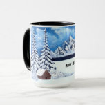 Winter Wonder Christmas Mug<br><div class="desc">Une tasse avec une belle scène hivernale incluant des montagnes enneigées,  des cabines rustiques et des greens enneigés. Oeuvre originale de W.B.</div>
