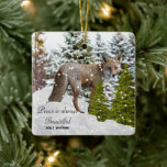 Winter Wonderland Fox céramique ornement<br><div class="desc">Cet ornement de Noël présente des arbres enneigés avec une illustration de renard dans la neige. L'accueil est une citation de Walt Whitman. Vous pouvez acheter cet ornement de vacances comme indiqué ou le modifier pour ajouter votre propre salutation.</div>