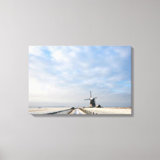 Winterlandschap met sneeuw en windmolen in Nederla Canvas Afdruk (Voorkant)