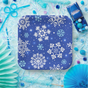 Wintervlokken in blauw papieren bordje