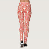 Wit decopatroon boven oranje achtergrond leggings (Achterkant)