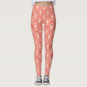 Wit decopatroon boven oranje achtergrond leggings (Voorkant)
