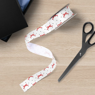 Wit en zwart stippelpatroon met rode lint