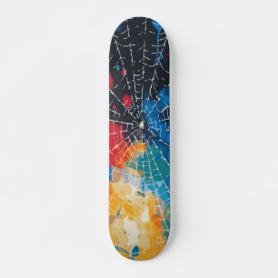 Wit spinnenweb op multi-kleur verfspatten skateboard