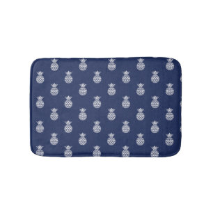 Witte ananas op marineblauw badmat