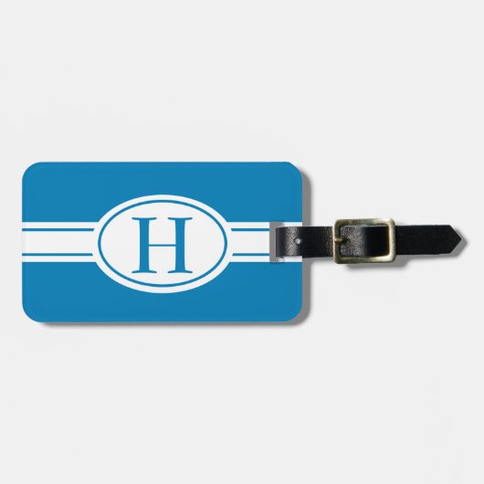 Witte band en ovaalschild met monogram op blauw bagagelabel (Voorkant horizontaal)