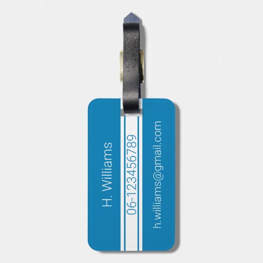 Witte band en ovaalschild met monogram op blauw bagagelabel (Achterkant verticaal)