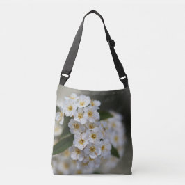 Witte bloemen in de lente crossbody tas