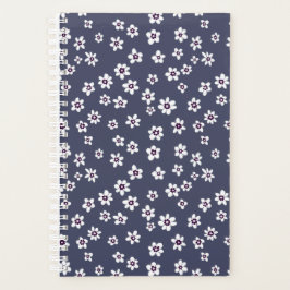 Witte bloemen op denim blauwe planner
