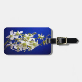 Witte bloemen tegen blauwe hemel bagagelabel