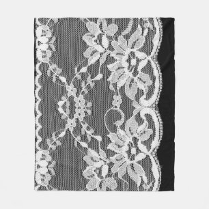 Witte bloemenkant: zwarte achtergrond. fleece deken