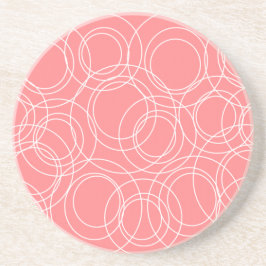 Witte cirkels op roze zandsteen onderzetter