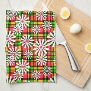 Witte daisy bloemen op een rood groene geruite rug theedoek