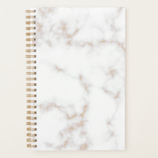 Witte en goudmarmer planner