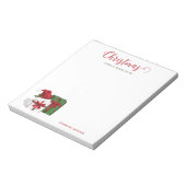Witte en groene wasdozen met een kersthat notitieblok (Gedraaid)