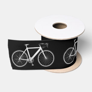 Witte fiets op zwart lint