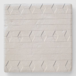 Witte gekleurde getextureerde muur, vierkant onder stenen onderzetter