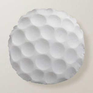 Witte golfbal met putjesontwerp rond kussen