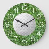 Witte golfbal op groen gras grote klok (Voorkant)