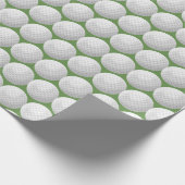 witte golfballen op groen cadeaupapier (Hoek)