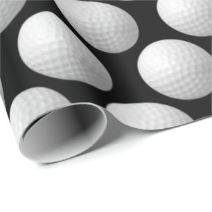 witte golfballen op zwart cadeaupapier