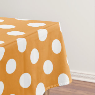 Witte haarvlekken op ambergeel tafelkleed