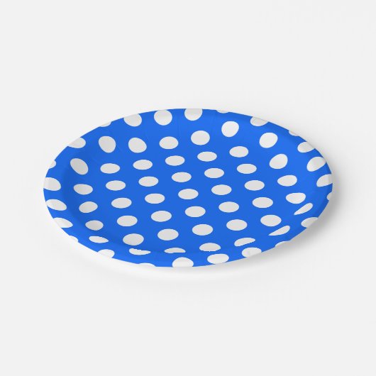 Witte haarvlekken op koningsblauw papieren bordje (Gekanteld)