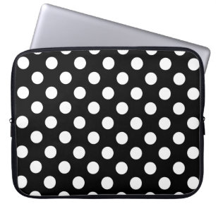 Witte haarvlekken op zwart laptop sleeve