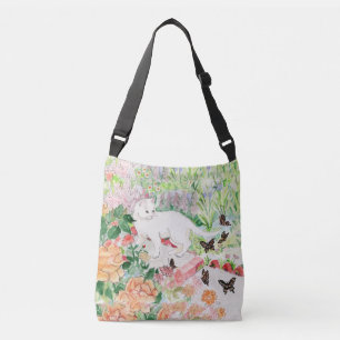 Witte kat in een tuinkruis tas