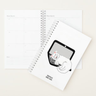 Witte kat slapen op laptop kleine planner