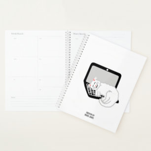 Witte kat slapen op laptop standaard planner