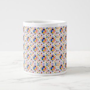 Witte keramische mok met een kleurrijk geometrisch