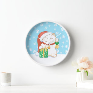 Witte kerstkat in een rood Pet